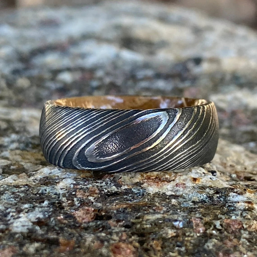 8mm Wide Damascus Steel Ring with a Whiskey Barrel Sleeve Handmade Wedding Band