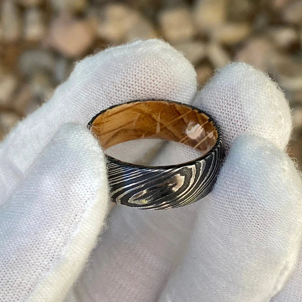 8mm Wide Damascus Steel Ring with a Whiskey Barrel Sleeve Handmade Wedding Band