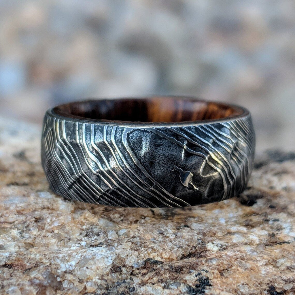 Damascus Steel Mens Wedding Band With Hammered Ironwood Sleeve
