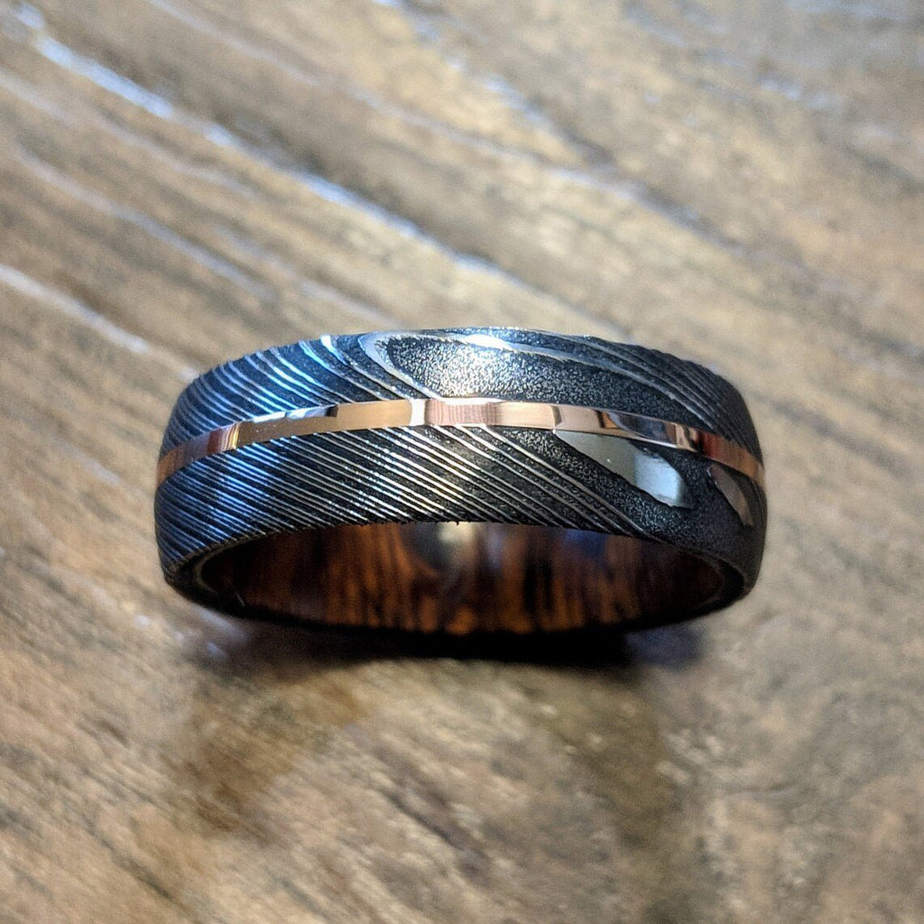 New 7mm Wide Damascus Steel Wedding Band with 14k Solid Rose Gold Inlay and Arizona Ironwood Sleeve