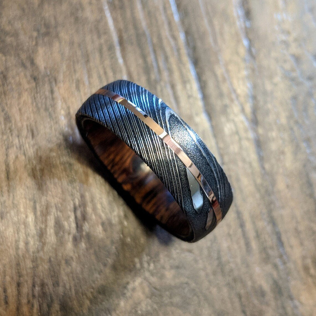 New 7mm Wide Damascus Steel Wedding Band with 14k Solid Rose Gold Inlay and Arizona Ironwood Sleeve
