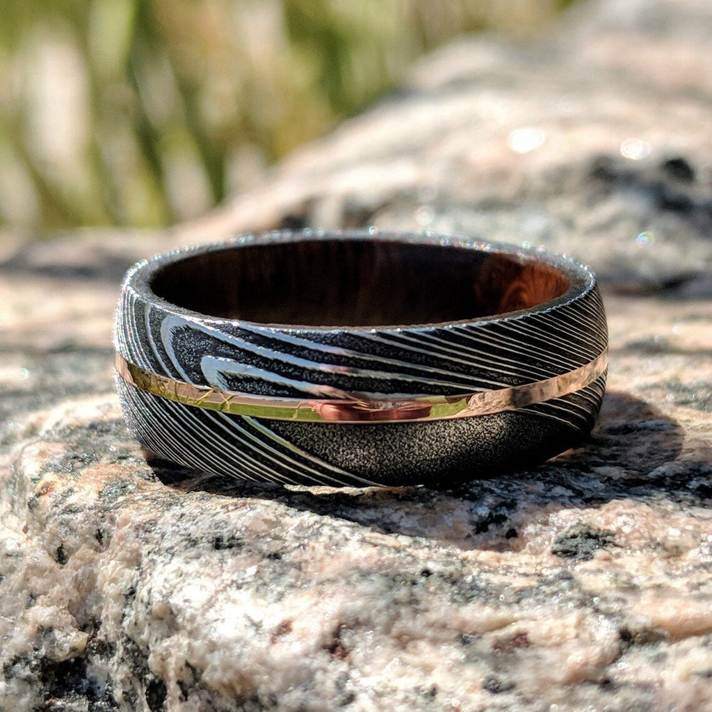 New 7mm Wide Damascus Steel Wedding Band with 14k Solid Rose Gold Inlay and Arizona Ironwood Sleeve