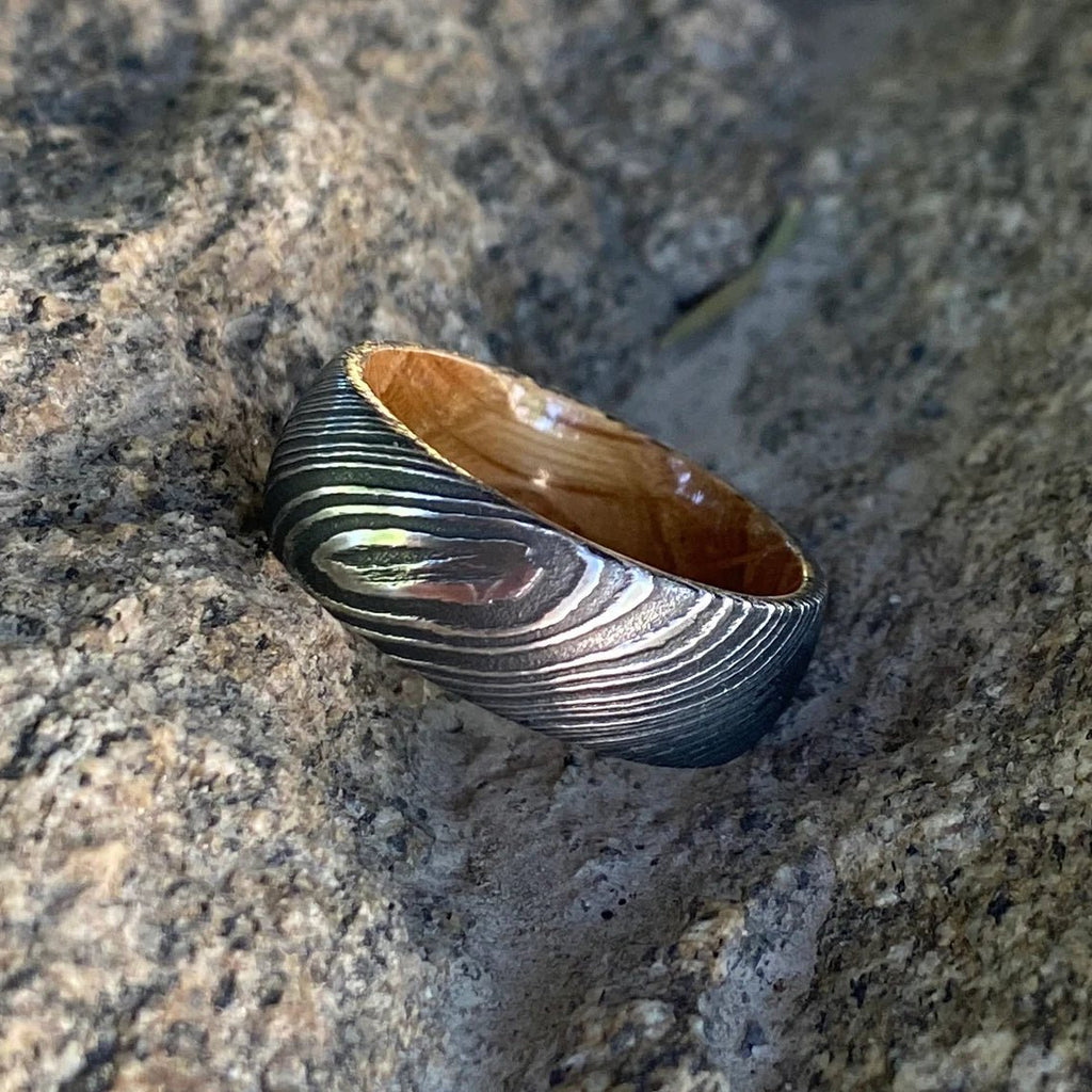 8mm Wide Damascus Steel Ring with a Whiskey Barrel Sleeve Handmade Wedding Band