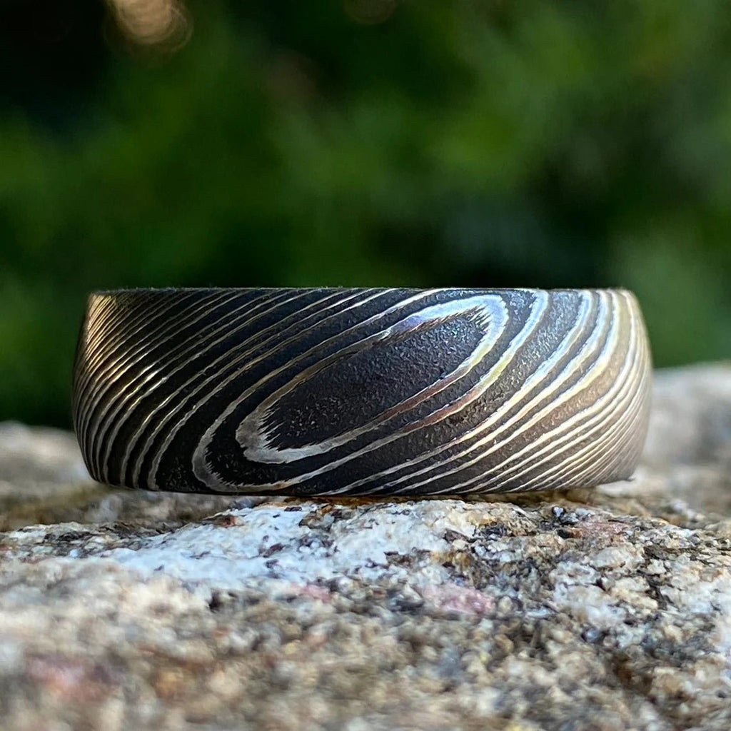 8mm Wide Damascus Steel Ring with a Whiskey Barrel Sleeve Handmade Wedding Band