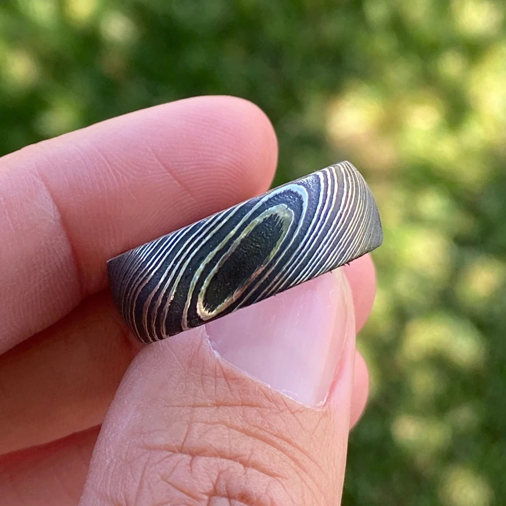 8mm Wide Damascus Steel Ring with a Whiskey Barrel Sleeve Handmade Wedding Band