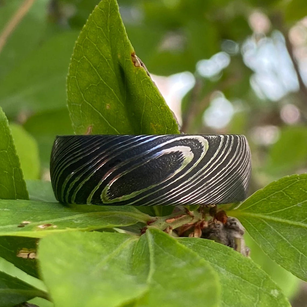 8mm Wide Damascus Steel Ring with a Whiskey Barrel Sleeve Handmade Wedding Band