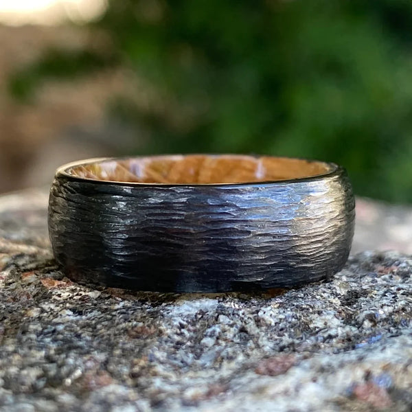 Unveiling the Mystique: Handcrafted Men's Black Titanium Wedding Band with Whiskey Barrel Core