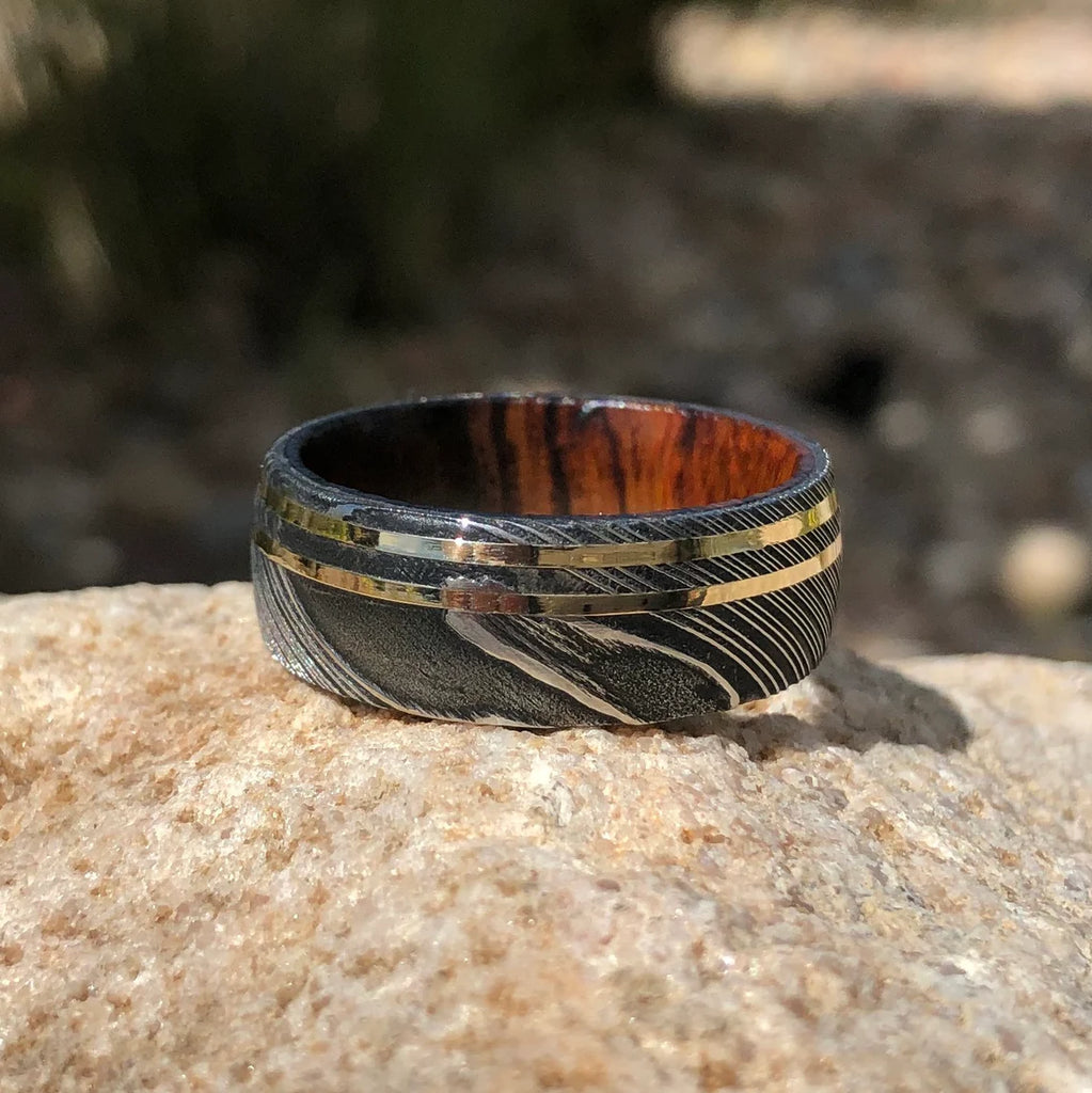 9mm Wide Damascus Steel Ring with Dual 14k Gold Off Center Grooves and a Arizona Ironwood Sleeve