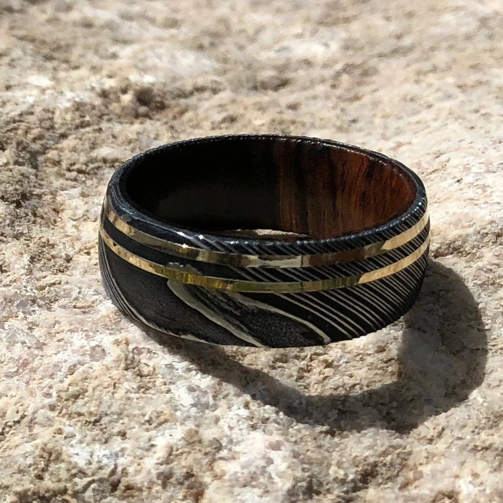 9mm Wide Damascus Steel Ring with Dual 14k Gold Off Center Grooves and a Arizona Ironwood Sleeve