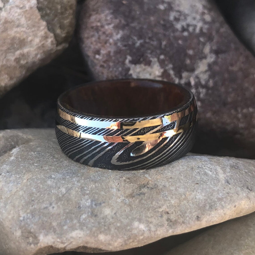 8mm Damascus Steel Ring with Dual 14k Yellow Gold & Rose Gold Off Center Grooves and a Arizona Ironwood Sleeve