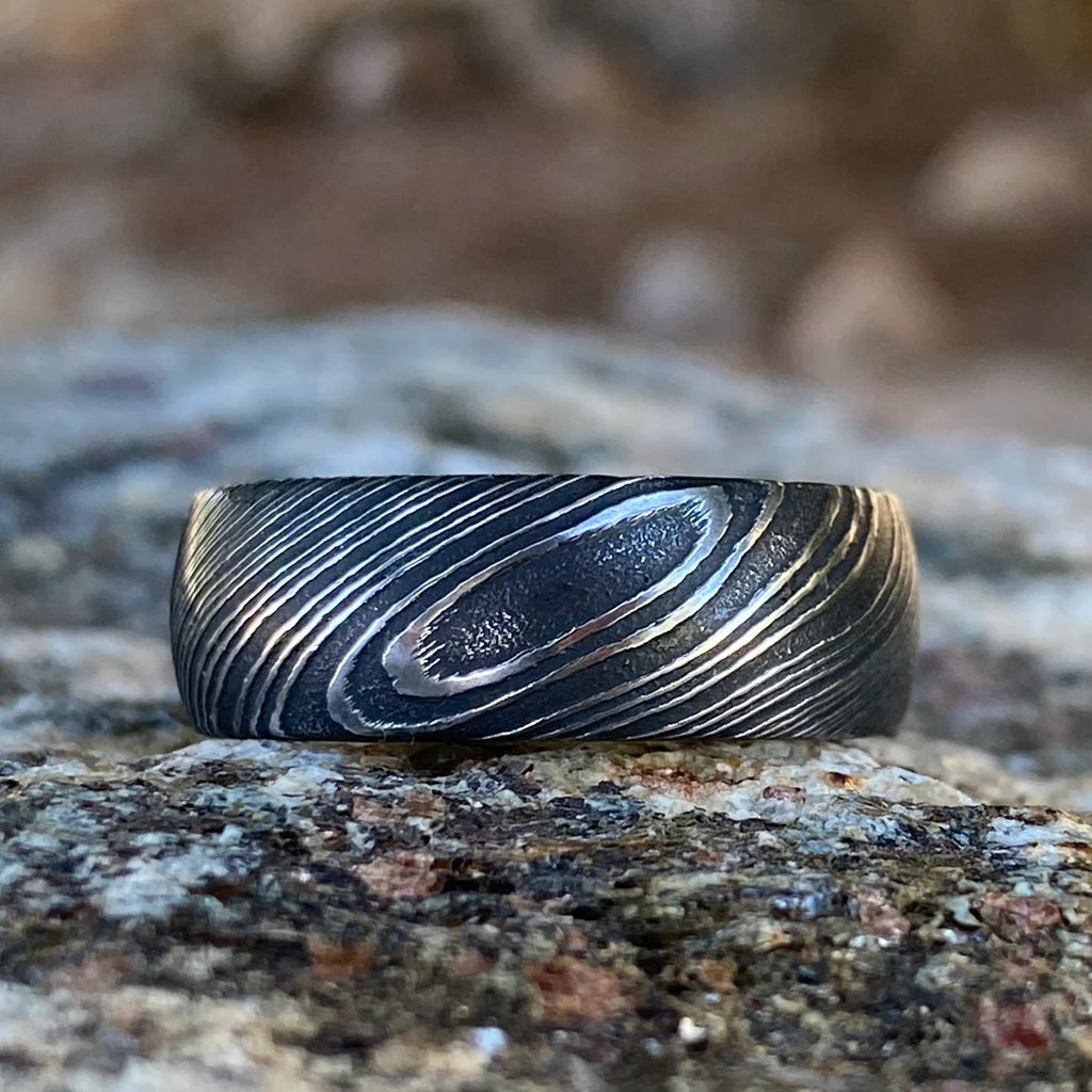 8mm Wide Damascus Steel Ring with a Whiskey Barrel Sleeve Handmade Wedding Band