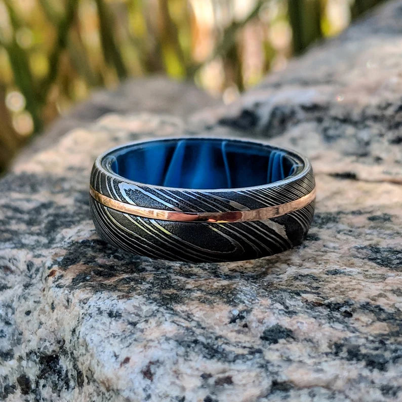 Damascus Steel Men's Wedding Band with 14k Rose Gold Inlay and Blue Ocean Sleeve